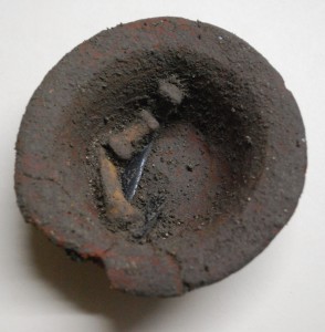 Cache from Ultimo showing finger digits and obsidian blade in finger bowl